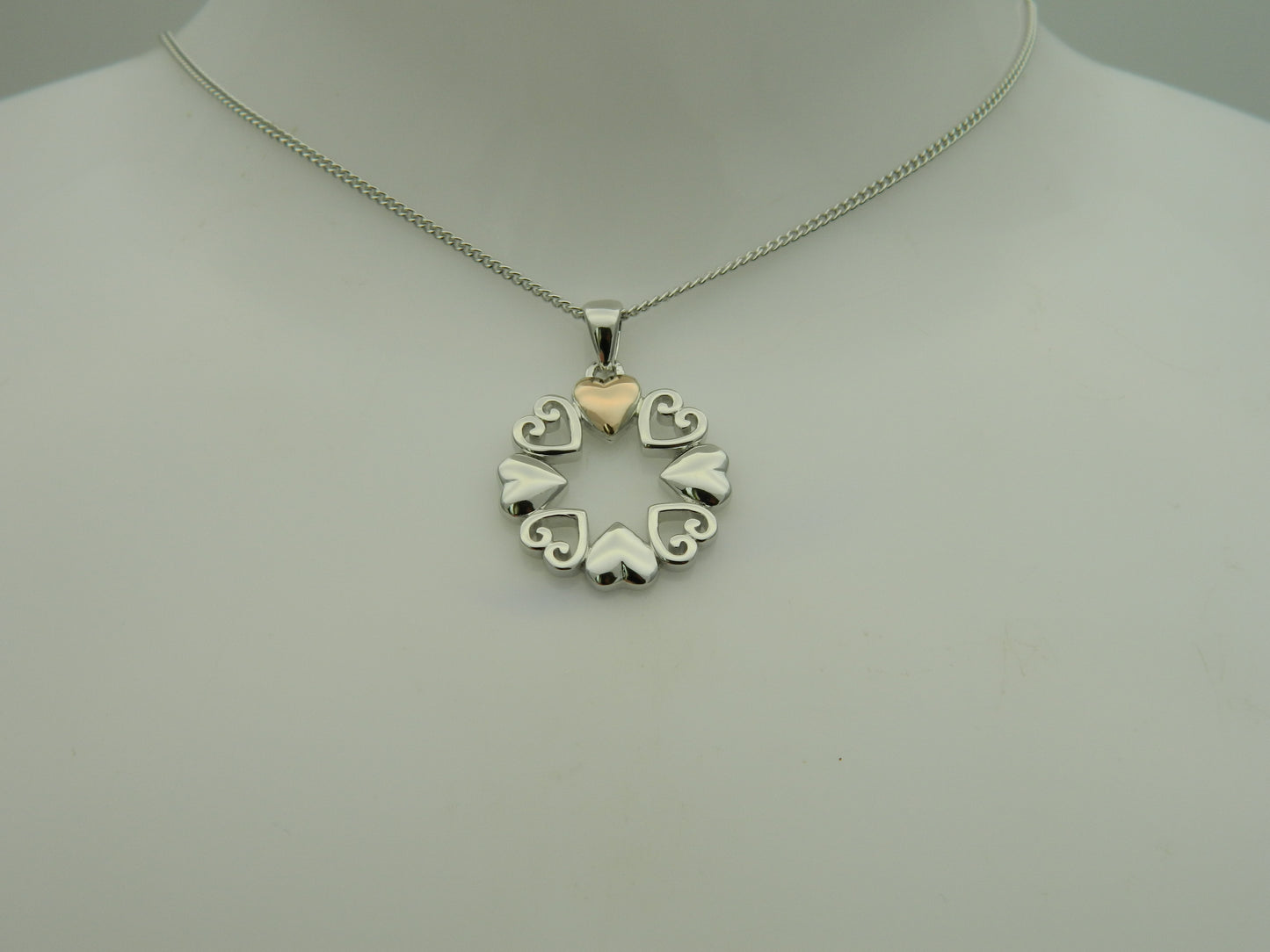 Clogau Sterling Silver & 9ct Rose Gold Hearts Embrace Circular Pendant